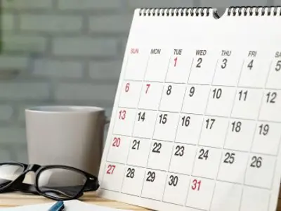 Calendar page close up on office desk.