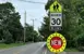 New 30 kilometre and hour speed sign in a school zone.