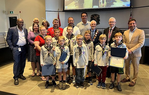 Bowmanville Cub Scouts with Regional Chair John Henry, Mayor Adrian Foster and members of Council.
