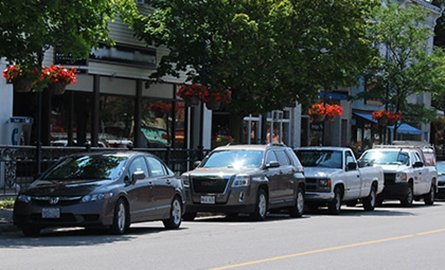 Cars parked on a downtown street.