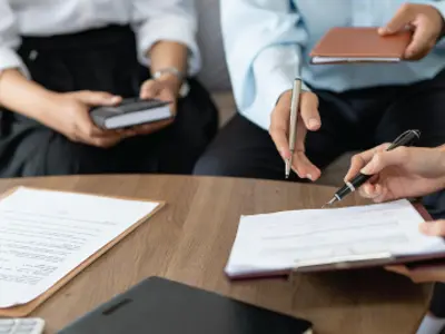 Real estate lawyer explaining contract to client.