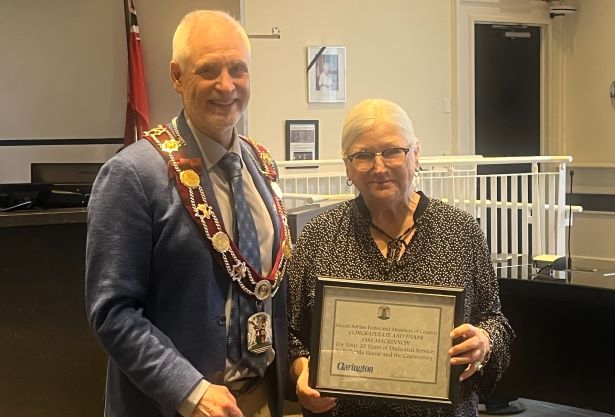 Mayor Adrian Foster presents Jaki MacKinnon with a certificate of acknowledgement for her work at Bethesda House. Left to right: Mayor Foster and Jaki MacKinnon