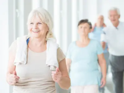 Group of seniors walking indoors.
