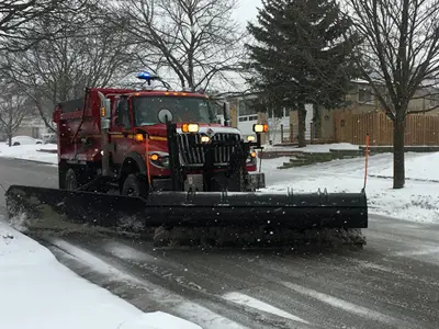 Snow plow on a Clarington street in winter conditions.