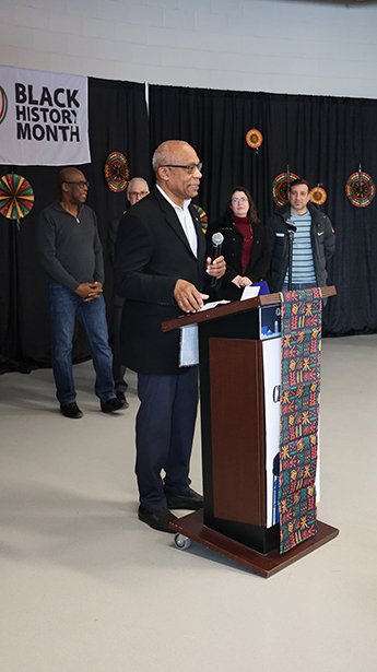 Hamlin Grange accepting the Mayor's Challenge Coinat the Black Vendor Village on February 8