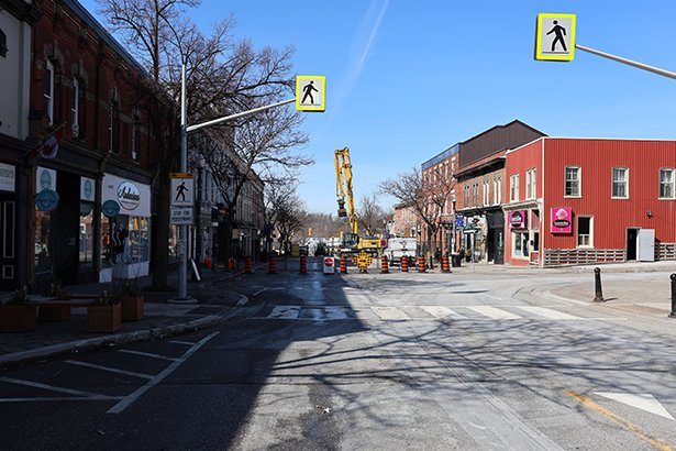 Fencing surrounding the buildings affected by the downtown Bowmanville fire where an investigation continues