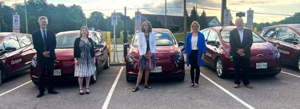 Councillor Joe Neal, Councillor Corinna Traill, Councillor Margaret Zwart, Councillor Janice Jones, and Councillor Ron Hooper stand with Clarington’s new light-duty EV fleet.