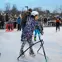 Girl using a skating aid at the outdoor rink at Diane Hamre Recreation Complex.