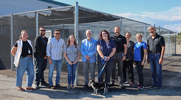 Mayor Adrian Foster, Council Members, and staff are joined with [grant representative’s name] at the newly expanded dog run at Clarington Animal Shelter, where dogs now enjoy four secure outdoor zones — double the space they had before.