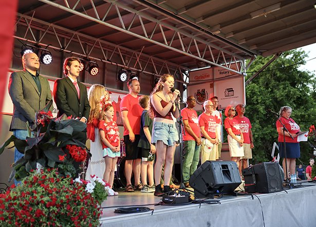 Clarington leaders and dignitaries on the main stage for the singing of 'O Canada